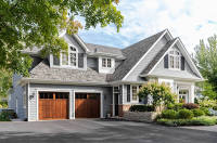 Beautiful upscale suburban home with attached garage representing First time homebuyer financing, refinance to lower rate, FHA refinance programs, real estate investor mortgage, and home refinance application options for homebuyers, homeowners, and property investors seeking mortgage solutions.